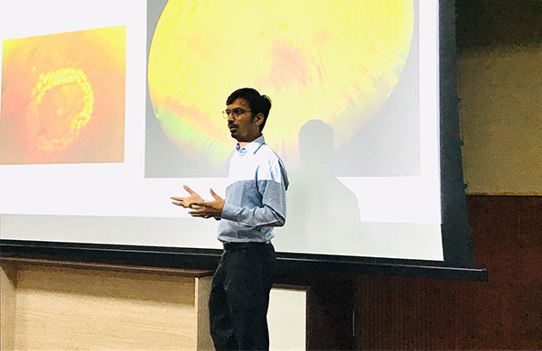 delivering a lecture on Lasers in Retinal Diseases